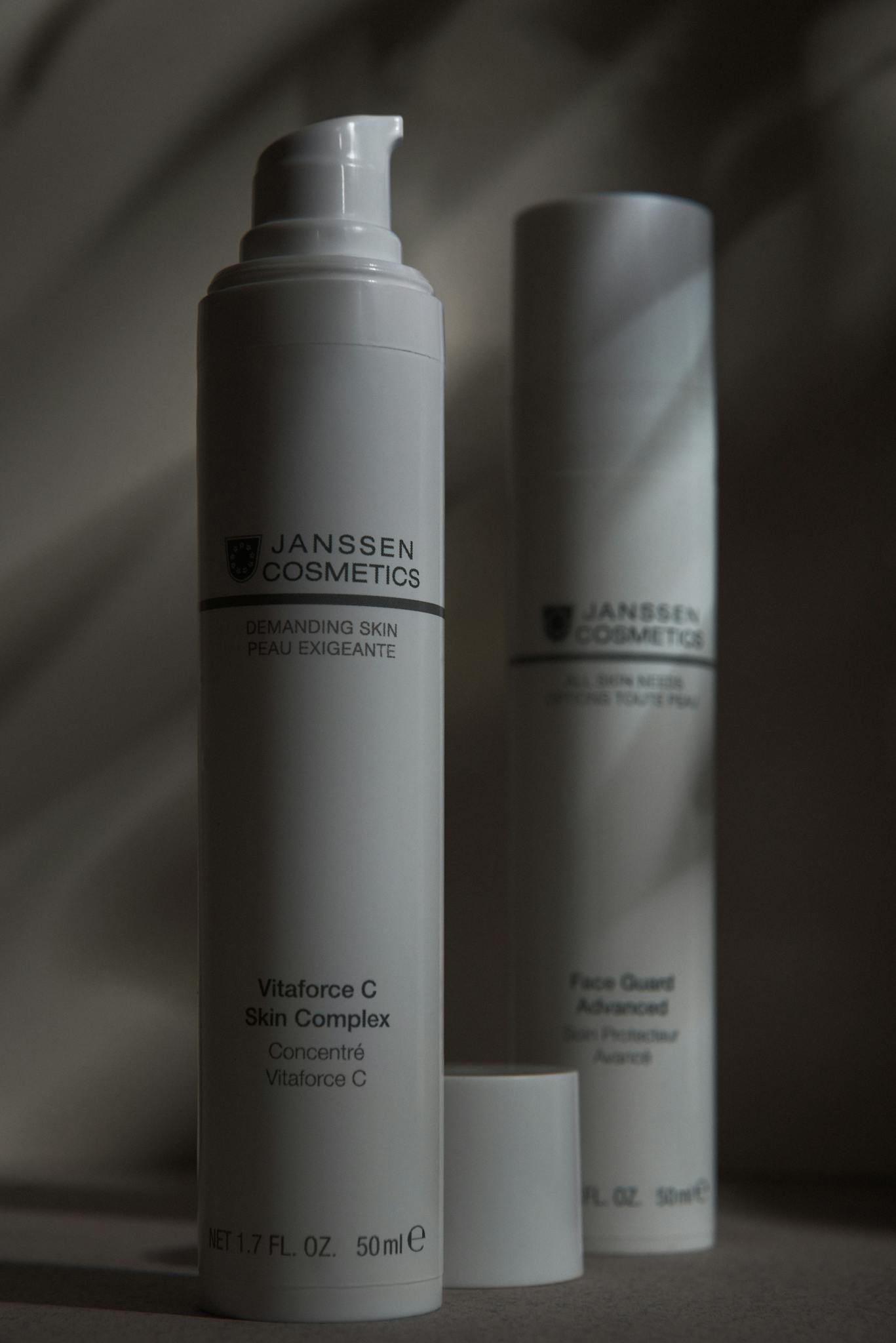 Modern product shoot of Janssen cosmetics against a white background highlighting minimalist design.